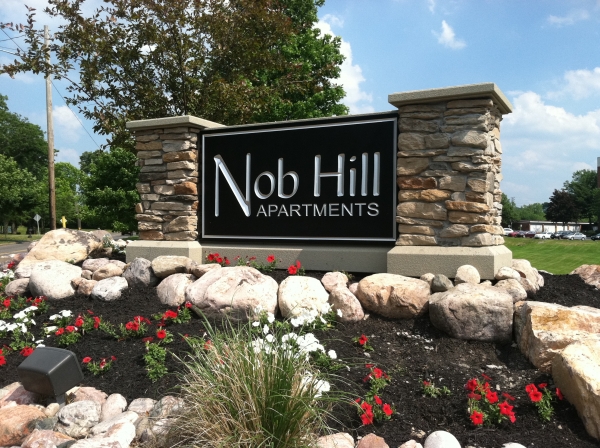 Architectural Signs, Monument Signs, custom signage, stone foundation :: HDU carved and painted sign with real stone finish :: Syracuse, NY, Pittsburgh, PA
